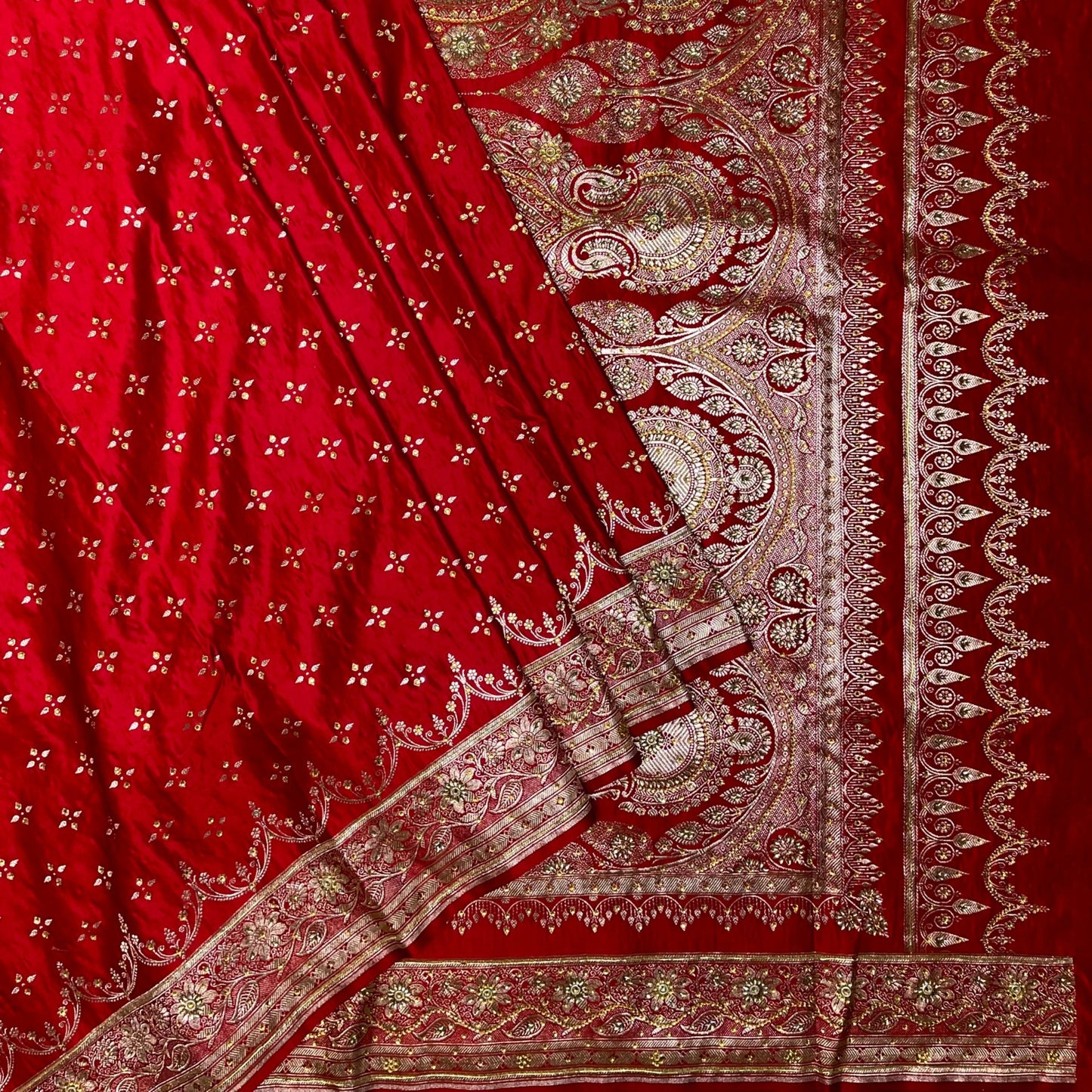 Red fabric with intricate gold patterns