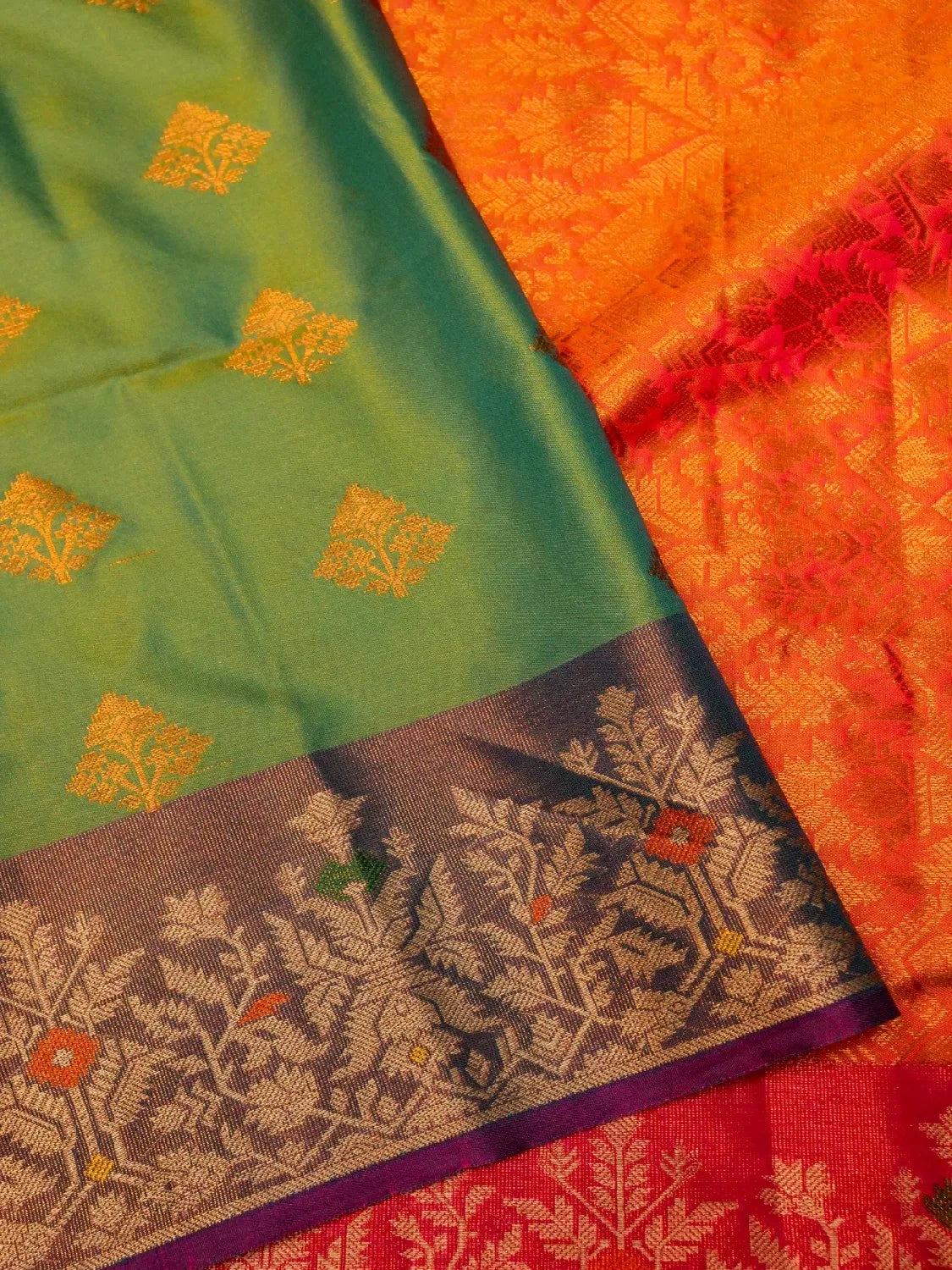 Handloom Leaf Green Banarasi Silk Saree with Contrast Violet Border & Tree Motifs DSK00121