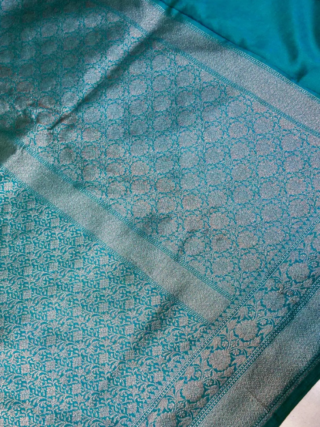 Radiant Firozi Teal Banarasi Katan Silk Saree with Silver Zari ‘Jangla’ Weave DSK0068