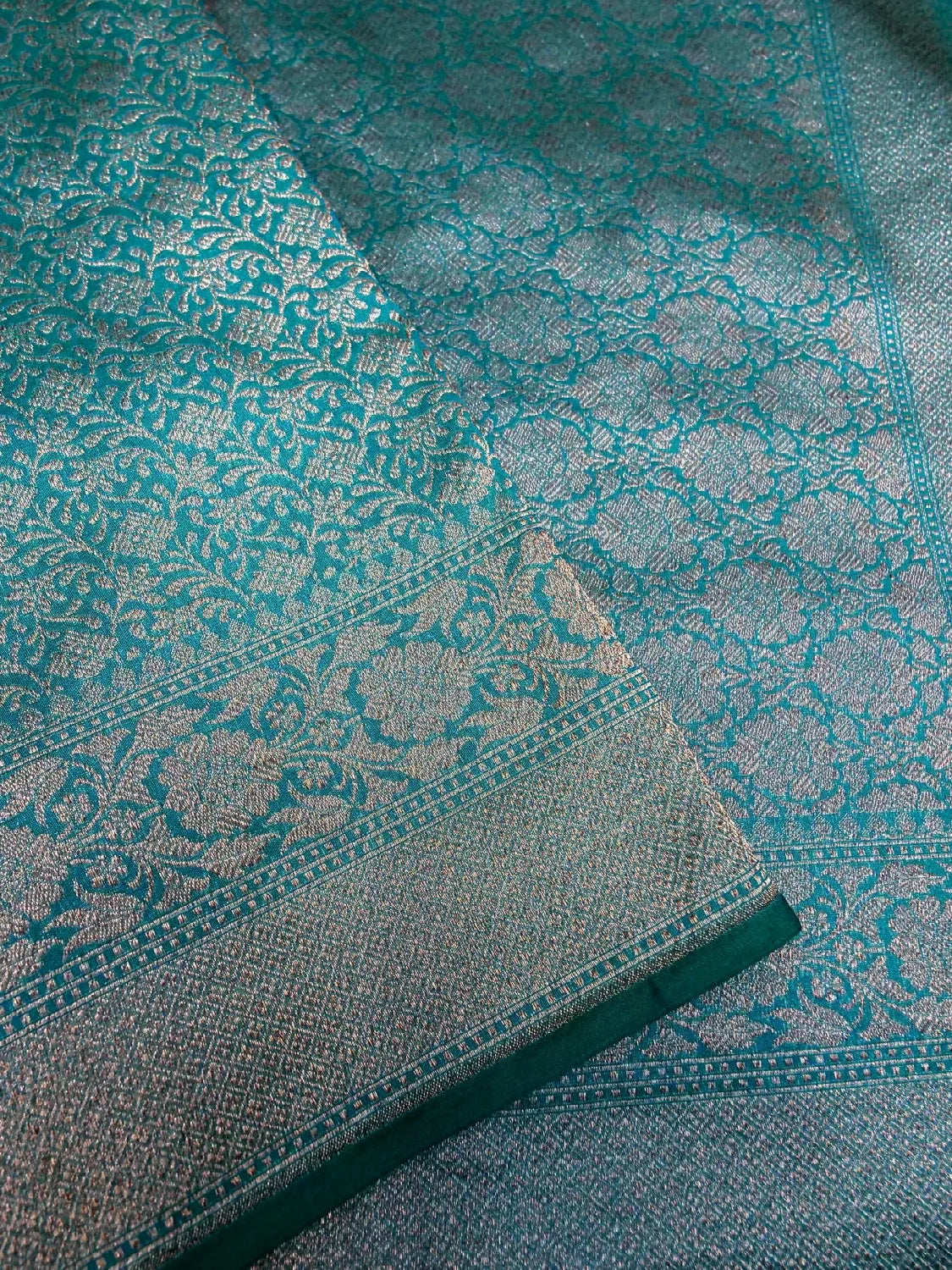 Radiant Firozi Teal Banarasi Katan Silk Saree with Silver Zari ‘Jangla’ Weave DSK0068
