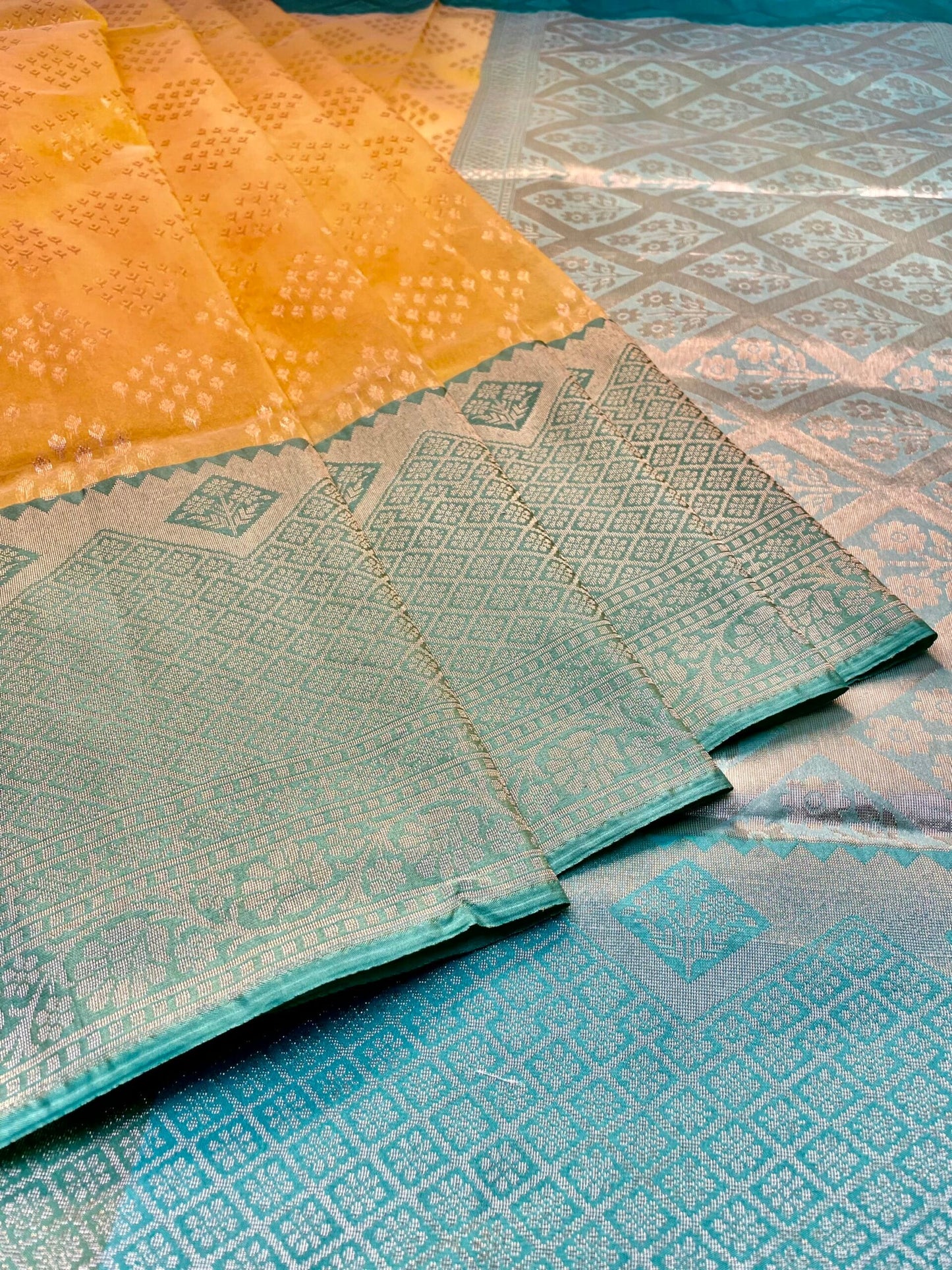 Mustard and Teal Organza Saree with Contrast Border and Allover Geometrical Body Design b0301ds