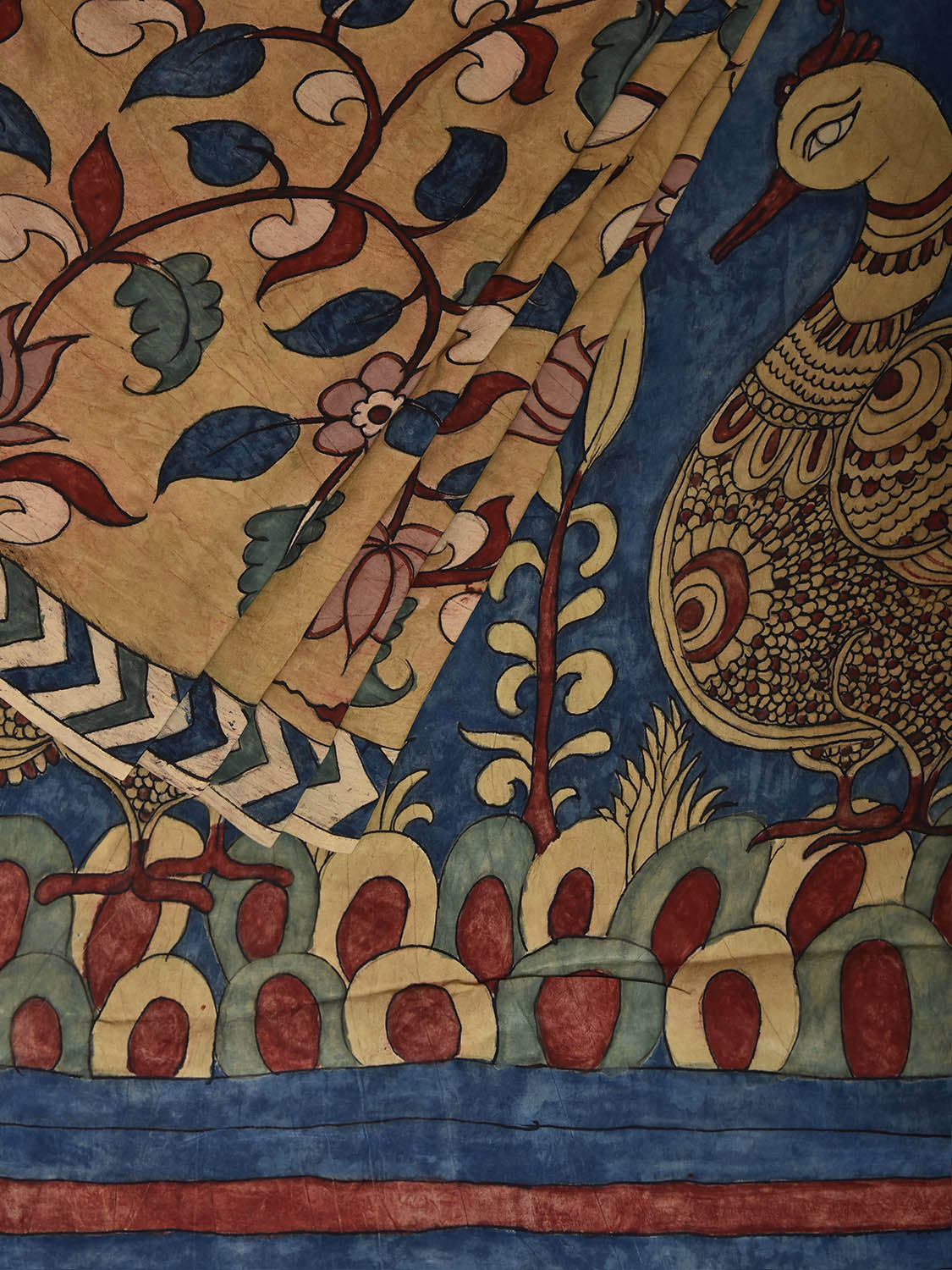 Mustard and Blue Kalamkari Hand Painted Crepe Saree with Floral and Peacocks Pallu Design KL085